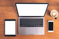 Top view mockup image of laptop with blank white screen , tablet pc , mobile phone and coffee cup