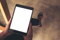 Woman`s hands holding black tablet pc with blank white desktop screen Royalty Free Stock Photo