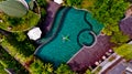 Top view of a model men in light green shorts is enjoying relax in pool. Royalty Free Stock Photo