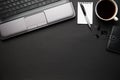 Top view of modern black office desk with laptop, notebook, pencil and a lot of things. Flat lay table layout. Copy space for text