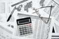 Top view of modern black office desk with notebook, pencil, financial reports and a lot of things. Flat lay table layout Royalty Free Stock Photo