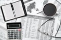 Top view of modern black office desk with notebook, pencil, financial statements and a lot of things. Flat lay table layout Royalty Free Stock Photo