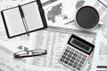 Top view of modern black office desk with notebook, pencil, financial statements and a lot of things. Flat lay table layout Royalty Free Stock Photo