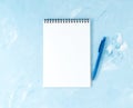 Top view of modern bright blue office desktop with pen or pencil, notepad. Mock up, empty space Royalty Free Stock Photo