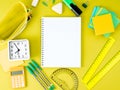 Top view of yellow office desktop with notebook in cage, school Royalty Free Stock Photo