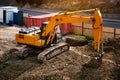 Top view of a modern excavator digs the ground at a construction site in the city Royalty Free Stock Photo