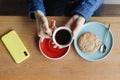 top view of a modern man in a coffee shop holding a red cup Royalty Free Stock Photo