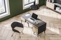 Top view of modern office interior with empty mock up laptop, wooden flooring, window and city view, desktop workplace and