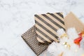 Top view of modern striped present box lay under white christmas Royalty Free Stock Photo