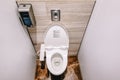 Top View Of Modern Toilet Bowl, And Toilet Paper In The white room is public restroom Royalty Free Stock Photo