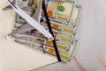 Top view of modern travel office desktop with US dollar bills a blank notepad and model airplane