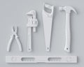 Top view of monochrome construction tools for repair and installation on white