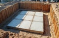 Top view of monolithic reinforced concrete foundation after formwork removal at construction site. Foundation pit with slab base Royalty Free Stock Photo