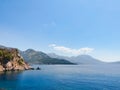 Top view Montenegro Sutomore stones beach blue turquoise Adriatic sea water mountains day Royalty Free Stock Photo