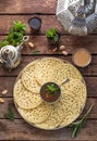 Top view of moroccan pancakes with mint tea