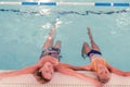 Top view of a mother and daughter in water