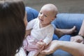 top view of a mother holding her happy baby girl at home. family and love concept Royalty Free Stock Photo