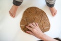 Top view of a mother pressing heart shape cookie cutter in rolled dough Royalty Free Stock Photo