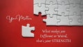 Top view of motivational quote on red cover - What makes you different or weird, that is your strength.With jigsaw Royalty Free Stock Photo