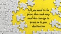 Top view of motivational quote on yellow cover with jigsaw puzzle missing pieces background. Royalty Free Stock Photo