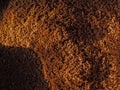 Top view of a hill of ground coffee.