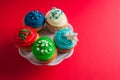 Top view muffins with colored cream and sprinkles Royalty Free Stock Photo