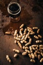 top view of mug of cold beer and peanuts Royalty Free Stock Photo