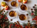 Top view of mulled apple cider with spices: cinnamon sticks, cloves, anise on white table Royalty Free Stock Photo