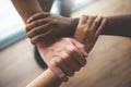 Top view of Multi-ethnic business people holding their hands together Royalty Free Stock Photo