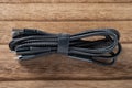 multi-plug cable on a wood background