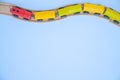 Top view on multicolor kids toy train cars bricks on wooden railway blue background. Copyspase. flat lay. Children toys on the