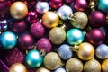 Top view on multicolour Christmas balls. Sparkling colourful new year tree toys. Holiday background composition. Flat