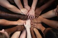 Top view of multiethnic group of people joining hands in circle, Closeup of diverse people joining their hands, top view, AI