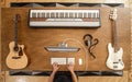 Top view of a musician creating music in his studio working on sound processing at the computer. Sound engineering concept Royalty Free Stock Photo