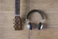 Top View of Musician Stuffs on Table. Guitar and Headphone on Wood Background.