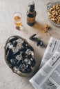 top view of mussels with ice cubes beer peanuts and newspapers Royalty Free Stock Photo