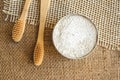 Top view on natural bamboo toothbrushes and kaolin dentifrice on rustic burlap background with copy space. Sustainable lifestyle