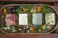 Top view of natural handmade skincare. Organic soap bars with plants extracts and oil bottles Royalty Free Stock Photo