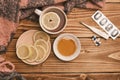 Top view Natural remedies for flu lemon and honey with cup of hot tea on a wooden table thermometer and pills Royalty Free Stock Photo