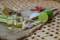 Top view Natural Spa Ingredients Lemongrass essential Oil with Aromatherapy Burners on wooden background. copy space Royalty Free Stock Photo