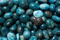 Top view of natural tumbled Apatite Stone pile under the light