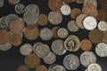 Top view New one pound sterling coin and penny on black background, Pile of different British money coins for business exchange,