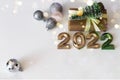 Top view new year light background with craft gifts, christmas tree and toys with bokeh and copy space Royalty Free Stock Photo