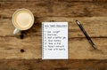 New Year Resolutions written on notebook with pen coffee on vintage wood table in Better life goals Royalty Free Stock Photo