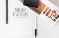 Top view new year resolutions 2020 paper note on modern office stationery on white table.pencil, notepad,ruler,pen and pencil box Royalty Free Stock Photo