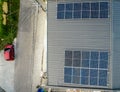 Top view of a newly constructed house with Polycrystalline Solar panels mounted on the ribbed metal roof