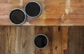 Top view on a newly opened can of wax, varnish, oil, paint on a freshly painted wooden surface. Several wood coating Royalty Free Stock Photo