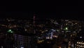 Top view of night city with flashes of fireworks. Stock footage. Dark city with flashes of multicolored fireworks in Royalty Free Stock Photo