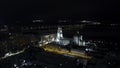 Top view of night city with glowing church. Clip. Beautiful view of night city with glowing buildings and bridge in Royalty Free Stock Photo