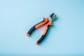Top view of Nippers or diagonal cutting pliers on blue background Royalty Free Stock Photo